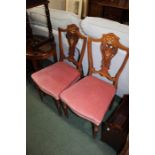 Pair of Edwardian mahogany and inlaid salon chairs, with urn and scroll inlaid backs, (2)