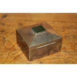 George V silver cigarette box, Birmingham 1934, makers marks rubbed, with green stone inset top, 9.