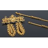 Victorian yellow metal brooch, with drops to the swag bar, together with chain sections, the