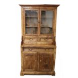 19th Century fruit wood dresser, the pediment above two glazed doors opening to reveal two