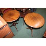 Pair of oak occasional tables, the circular tops raised on turned stems and tripod legs, 50cm