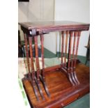 Nest of three mahogany and satinwood banded tables, with reeded friezes, raised on turned legs,