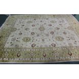 Chinese carpet, the cream ground with foliate decoration, surrounded by multiple borders and