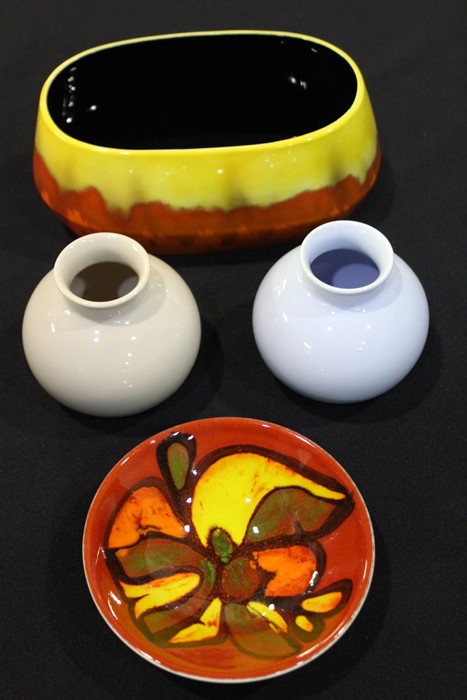 Poole pottery, to include a red and orange bowl, two vases and a Sylvac jardinière, (4)