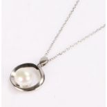 Silver pearl set pendant, on a silver necklace