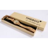 Timeboo bamboo wristwatch, the signed dial with baton markers, on a long cork bracelet, the case