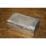 George V silver cigarette box, Birmingham 1933, makers marks rubbed, the lid initialled WOH, AF,