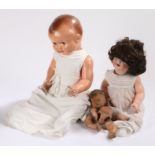 Simon & Halbig 126 bisque headed doll, with brown hair, fluttering eyes and articulated limbs,