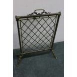 Edwardian brass and leaded glass firescreen, with pierced carrying handle, diamond patterned lead