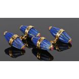 Pair of lapis lazuli and ruby cufflinks, the conical ended fluted carved lapis lazuli ends set