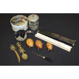 Collection of items, to include a caddy spoon, three turned pig peppers and salts, a silver plated