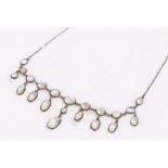 Sterling silver and moonstone necklace, with circular and oval moonstones (one stone missing)