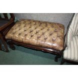 George III style footstool, the buttoned brown leather top raised on acanthus leaf and scroll carved