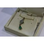 9 carat gold necklace with emerald and clear paste pendant, 2.2g