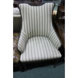 Mahogany armchair, with leaf and gadrooned carving to the pad back and arms on the stuff over seat