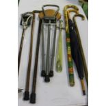 Collection of walking sticks, and a shooting stick