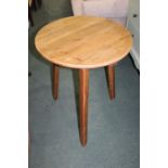Circular pine occasional table, on triangular legs, 59cm diameter