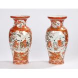 Pair of Japanese Satsuma vases, with figural scenes in panels and fans with a deep orange ground