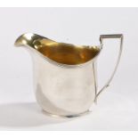 George III silver milk jug, London 1800, maker John Emes, with reeded angular handle and rim, gilt