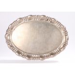 Continental white metal tray, of oval form with gadrooned border, 43.5cm x 30.5cmScratches to