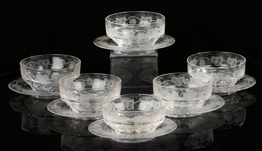 Set of six Victorian glass finger bowls and saucers, with grape and flower etched decoration, the