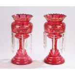 Pair of Victorian ruby glass lustres, with enamelled foliate decoration and hanging clear glass