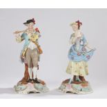 Pair of Sitzendorf porcelain figures, of a courting couple, the gentleman playing a flute and the