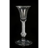 George III wine glass, the trumpet bowl above an air twist stem upon the knob with air tears and