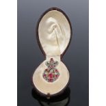 Fine ruby and diamond set pendant, with a central hanging ruby and diamond and ruby surround, a