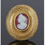 19th century yellow metal cameo brooch, with a carved cameo of a lady in profile set in engraved