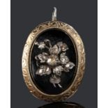 Victorian diamond set mourning pendant, the rose cut diamond set flower design with a black ground