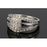 9 carat white gold diamond set cluster ring, with a shaped square head and three bands to the