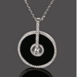 Piaget 18 carat gold and diamond set pendant necklace, of disc form and central diamond, diamonds to