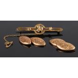 Pair of 9 carat gold cufflinks, oval form, 2.7 grams, together with a brooch having a central clover