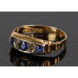 18 carat gold sapphire and diamond set ring, with three sapphires and two diamonds to the head, ring