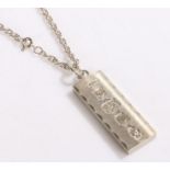 Silver ingot pendant on a white metal chain