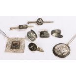 Collection of silver and niello work jewellery, to include filigree pendant, camel pendant, tiepin