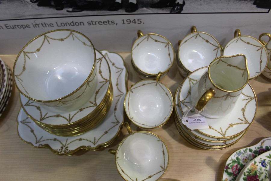 Paragon China porcelain tea service, with gilt foliate swag decoration, consisting of twelve teacups