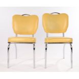 Pair of Stoneville Furniture Company diner style chairs, the backs and seats upholstered in yellow