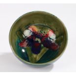 Moorcroft dish the green ground with iris decoration, facsimile W.M. Moorcroft signature to base and