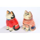 Two Joan and David De Bethel Rye pottery cats, depicted wearing a red jacket, the other depicted