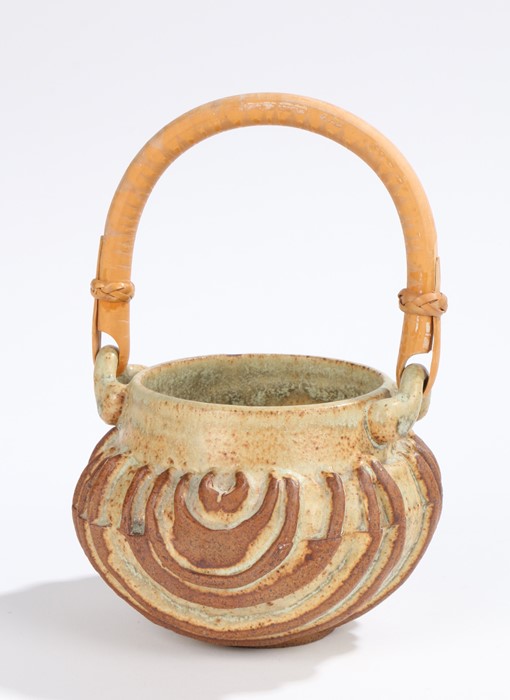 Bernard Rooke pottery basket, with steamed cane handle. the body with ribbed semi-circular