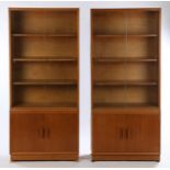 Pair of 1970's teak bookcases, each with two sliding glass doors opening to reveal three interior