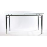 Late 20th Century glass and chrome table, the plate glass top raised on cylindrical legs, 145cm x