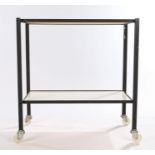 Mid 20th century two tier tea trolley, with white veneered trays on black metal supports and