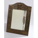 Arts and Crafts brass framed mirror with embossed foliate decoration, 37cm x 51cmMirror silvering