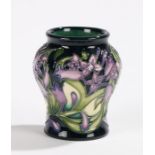 Moorcroft Isis pattern vase, the bulbous neck above a tapering body, with foliate decoration,