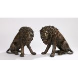 Pair of cast bronze lions, modelled in seated positions, 26cm highSome white marks between claws