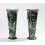 Pair of C.H. Brannam Pottery vases, of tapering cylindrical form, decorated with flowers on a