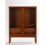 20th Century teak bookcase, with two glazed doors opening to reveal two interior shelves, military
